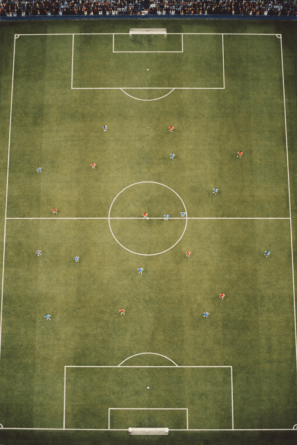 Bird's eye view of a football match in progress, players spread across the pitch